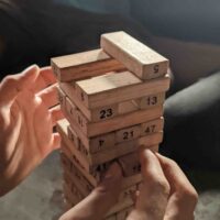 Use two hands in Jenga